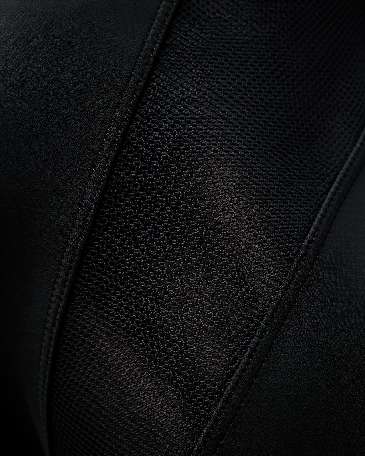 Micro-mesh panel set into black fabric